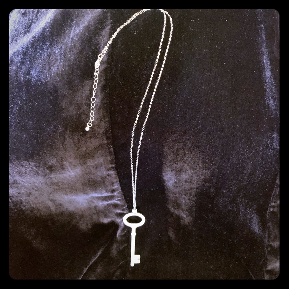 Silver tone key pendant necklace